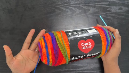 Red Heart Super Saver self-striping yarn used for the rainbow mesh skirt 
