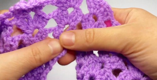 Sleeve edging detail on a handmade crochet children's top.