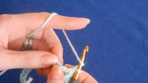 Close-up of Crochet V-Stitch showing evenly spaced open V shapes.