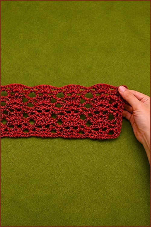 Handmade crochet lace stitch sample using medium weight yarn.