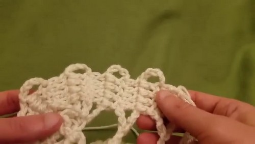 Close-up of Bruges Lace crochet showing ribbon arches and joins.