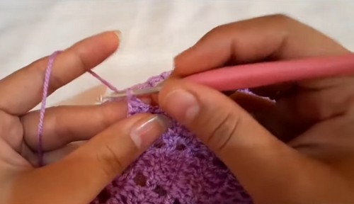 Working the collar edge in purple with a pink hook, the open shell repeats widening toward the outer rim of the collar.