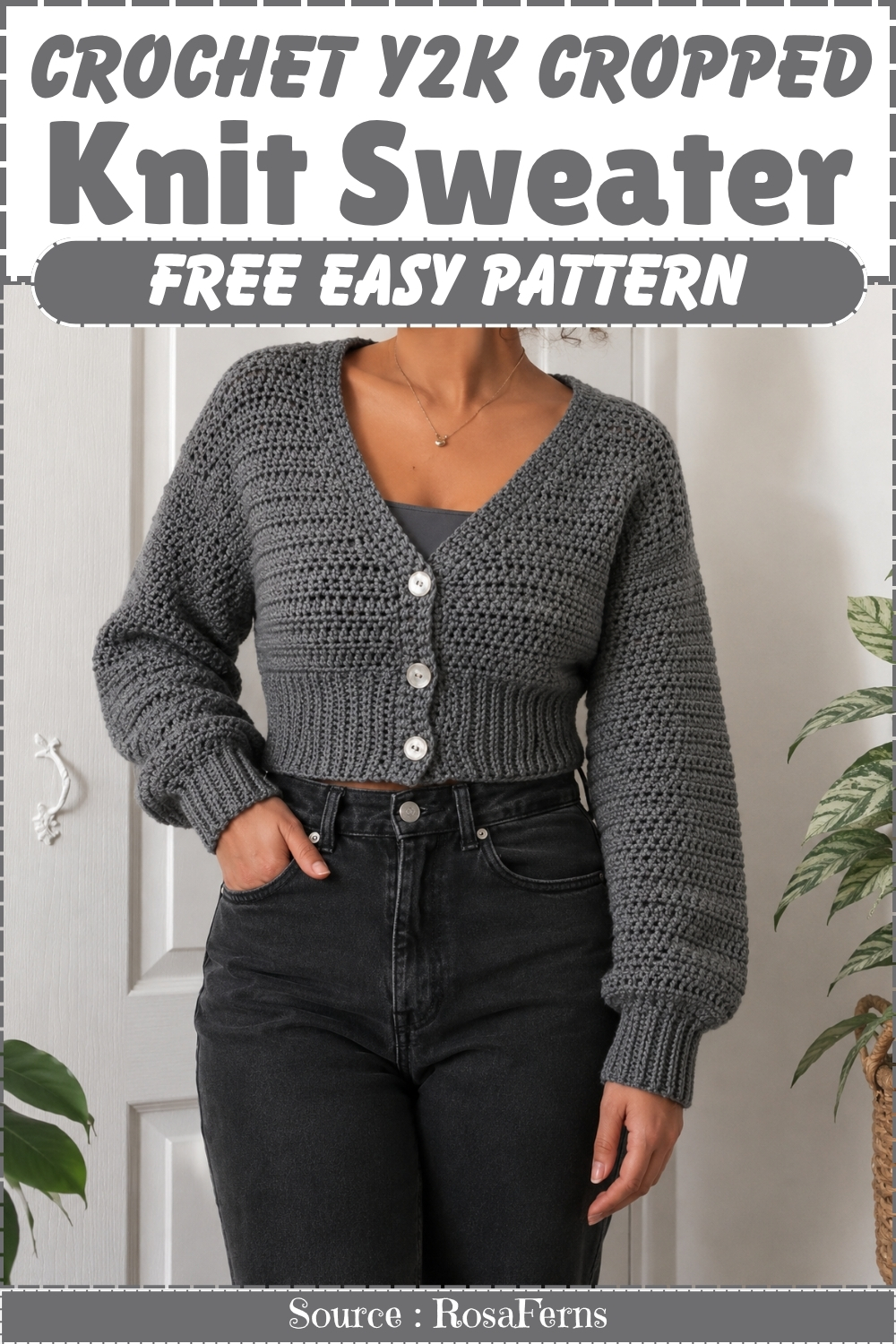 Grey crochet cropped cardigan with three white buttons and a v neckline, worn over black jeans