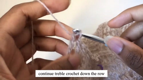 Video tutorial screenshot showing treble crochet being worked along a row of the mohair sweater with caption text visible.